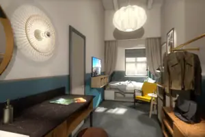 S-Studio Ein Zimmer mit einem Bett und einem Stuhl.