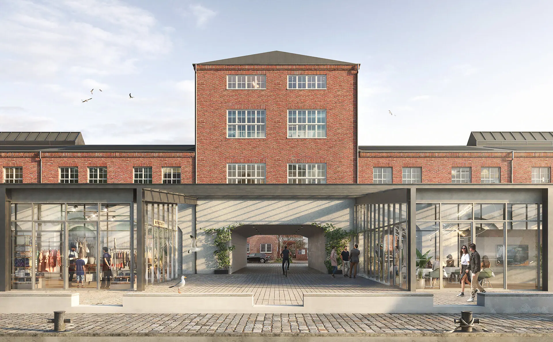 HENRI Hotel Cuxhaven Ein Gebäude mit Glastüren im Freien.