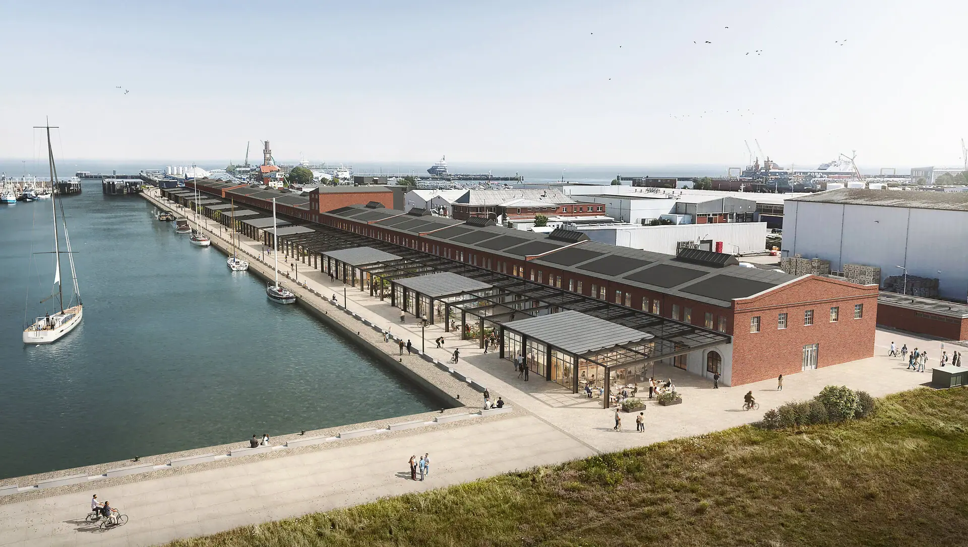 HENRI Cuxhaven Ein Dock mit einem Gebäude und einem Gewässer im Freien.